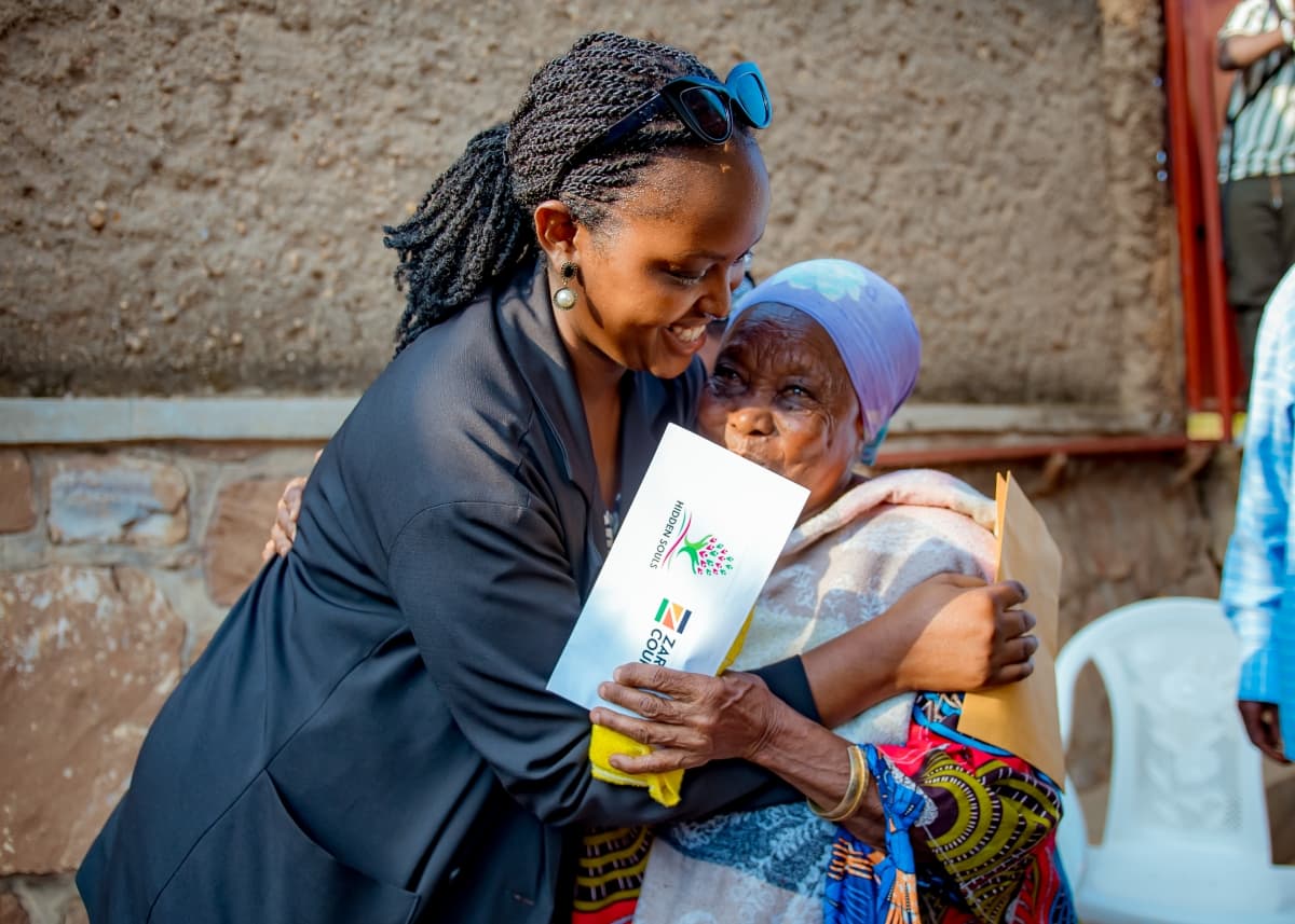 Hidden Souls founder embracing an elderly beneficiary