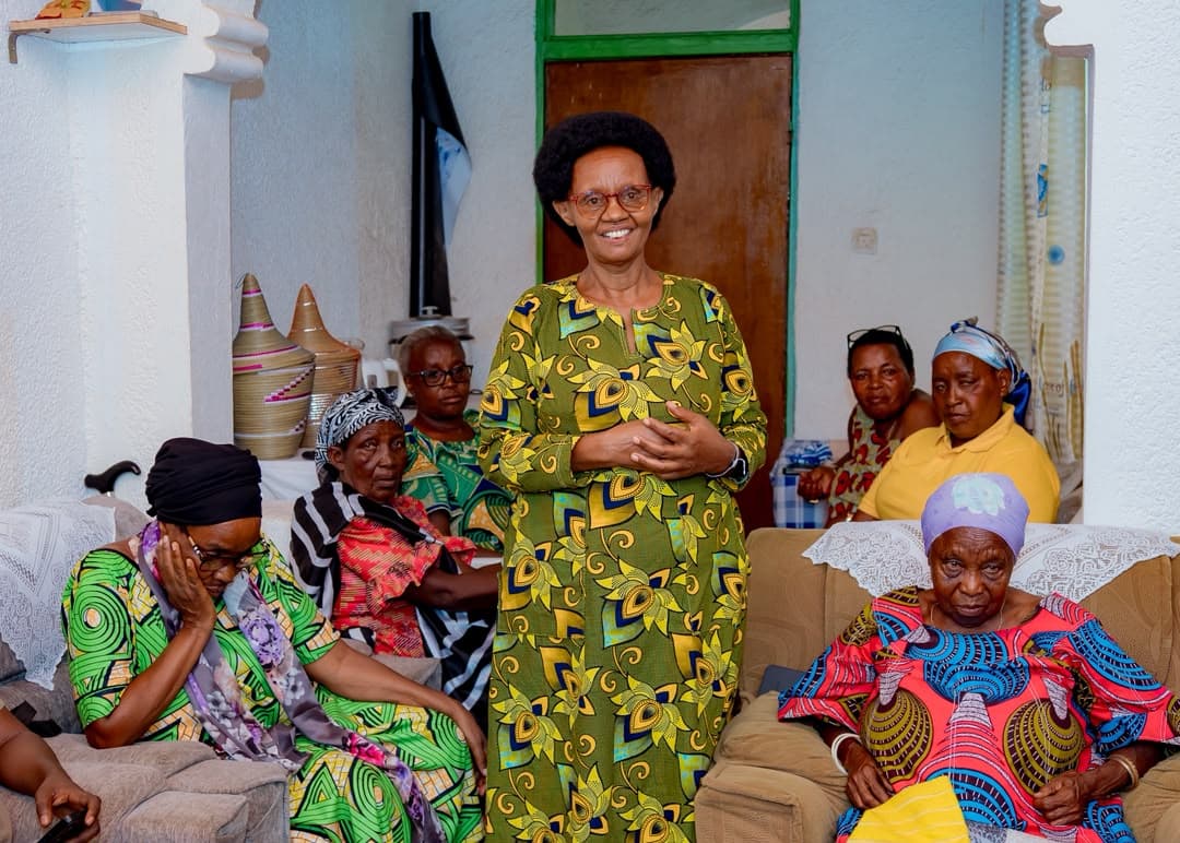 Hidden Souls leader smiling with elders during a home visit